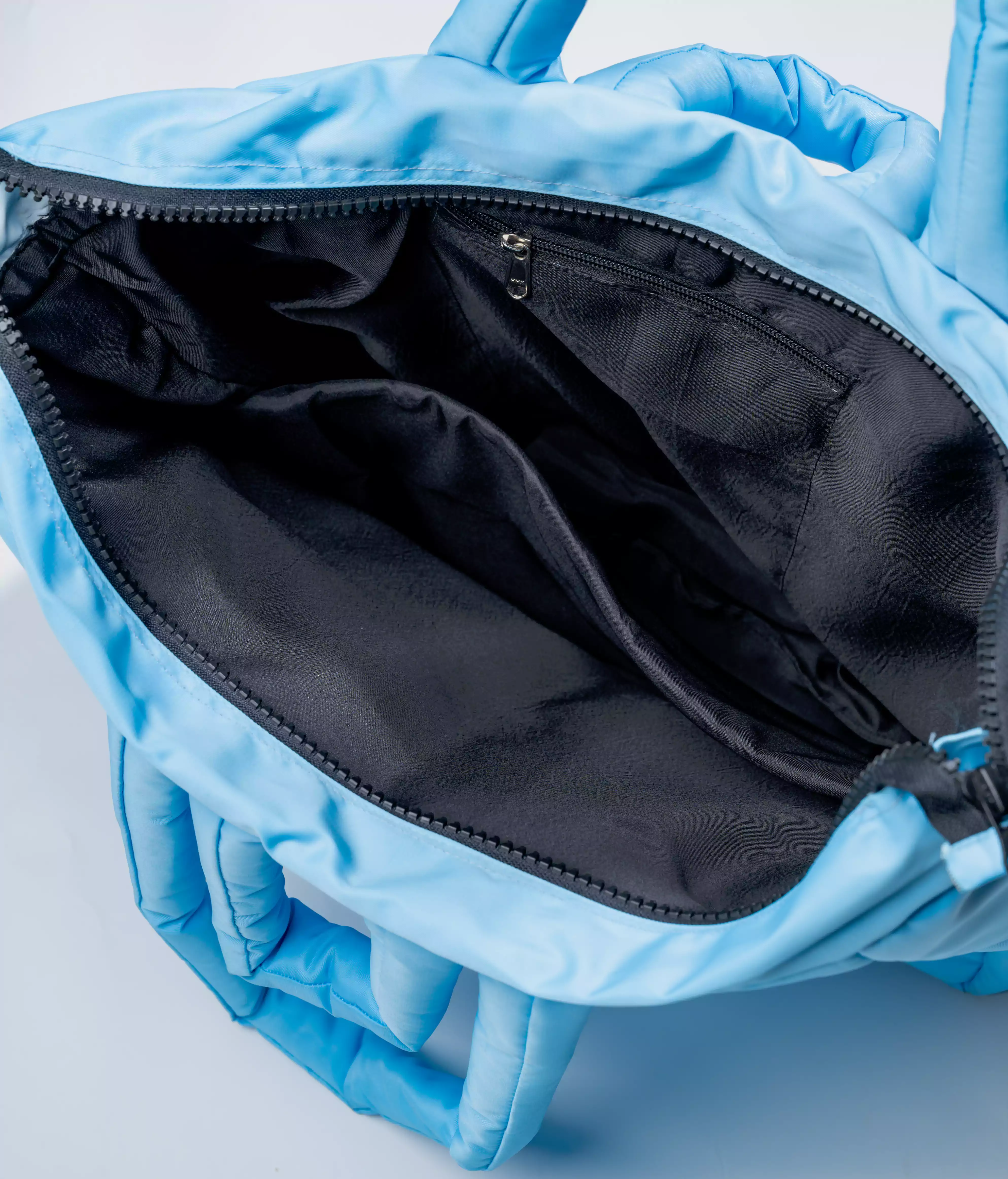 blue puffer tote bag inside 