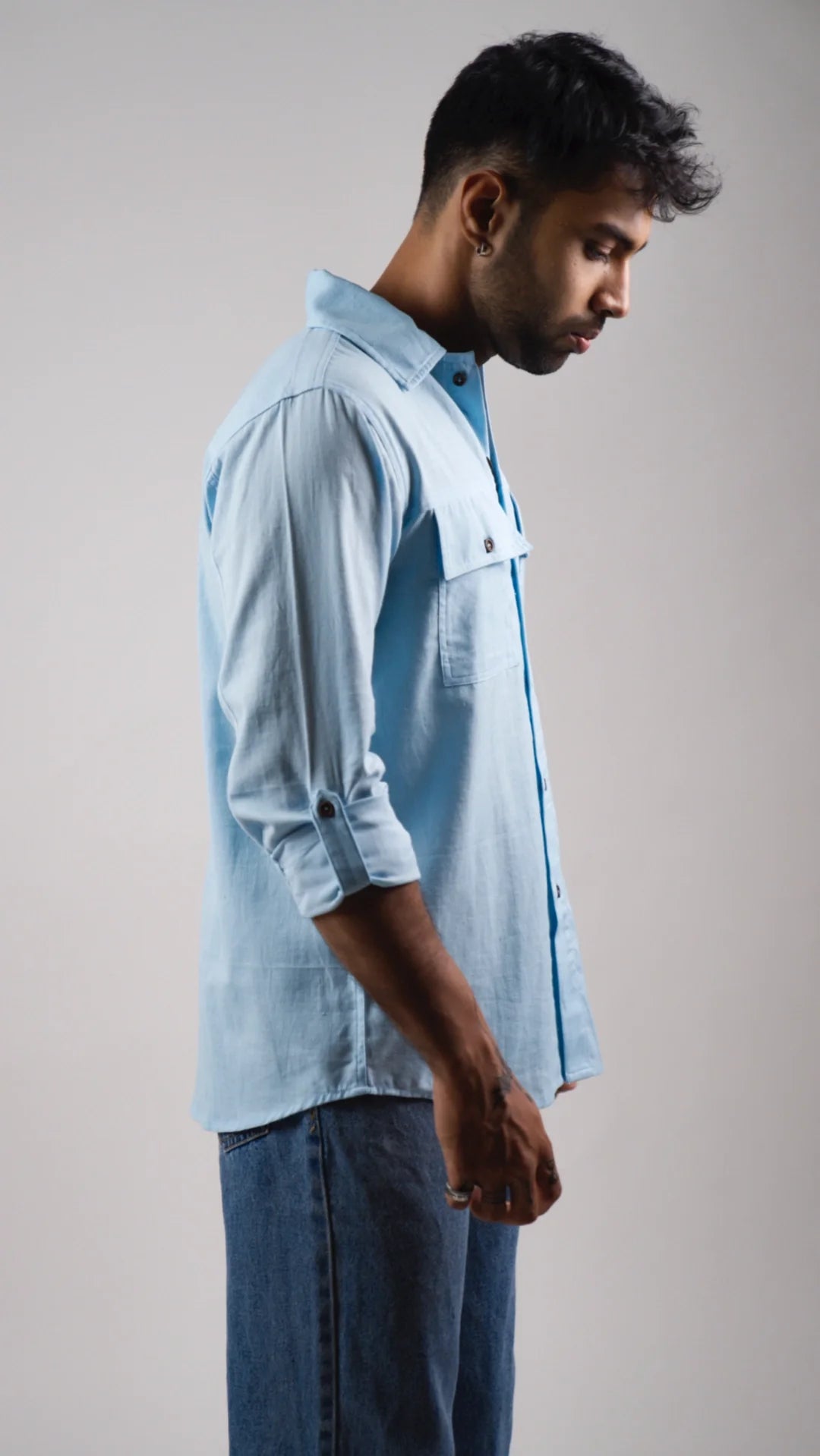 male model side view rolled sleeve