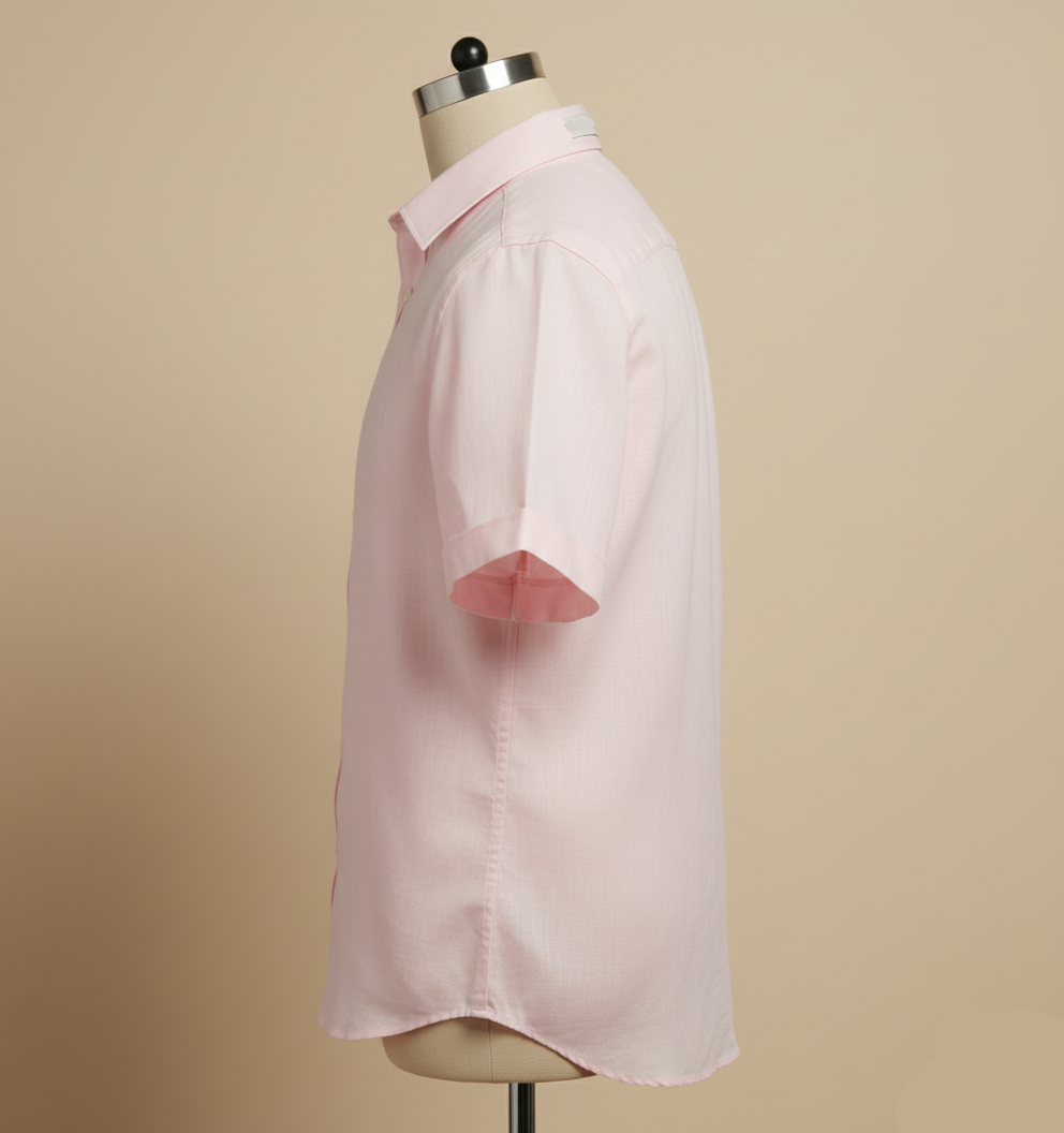 Pink shirt on a mannequin against a beige background